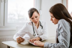 Doctor counseling patient during addiction detox process