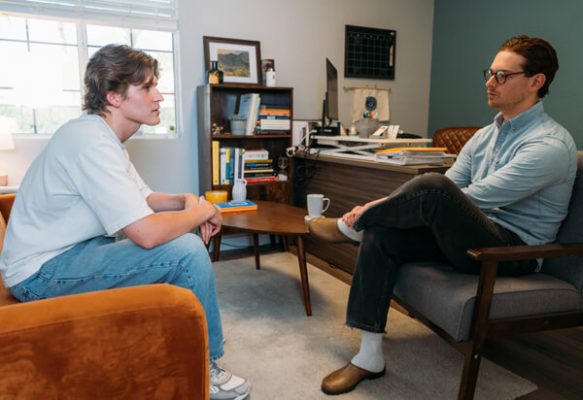 A man and therapist discuss considerations for sober living