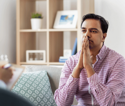 A therapist and his patient discuss medication assisted treatment options